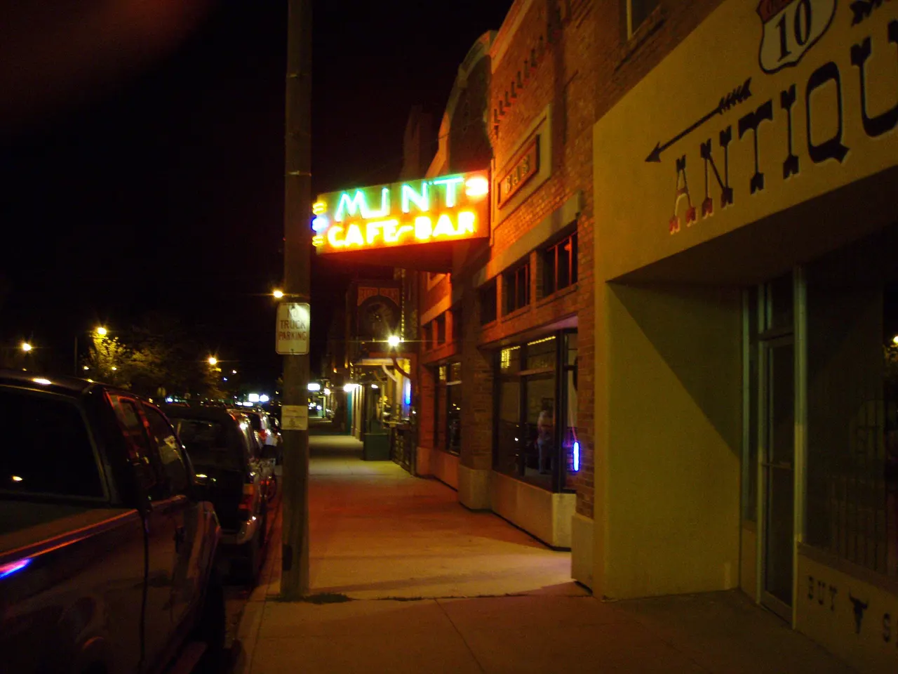 The Mint Cafe and Bar sign on Main Street in Belgrade, Montana at night