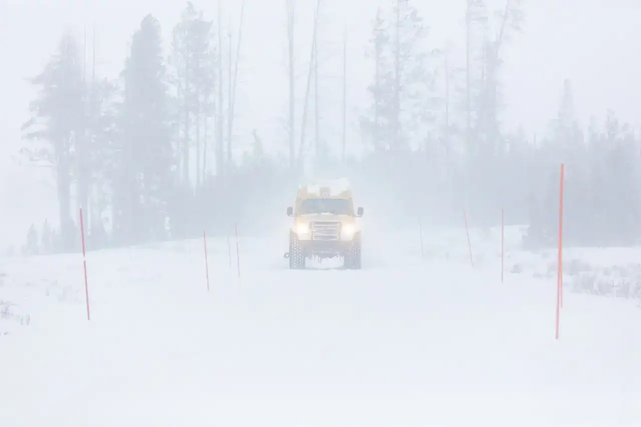 A snowcoach in Yellowstone in winter